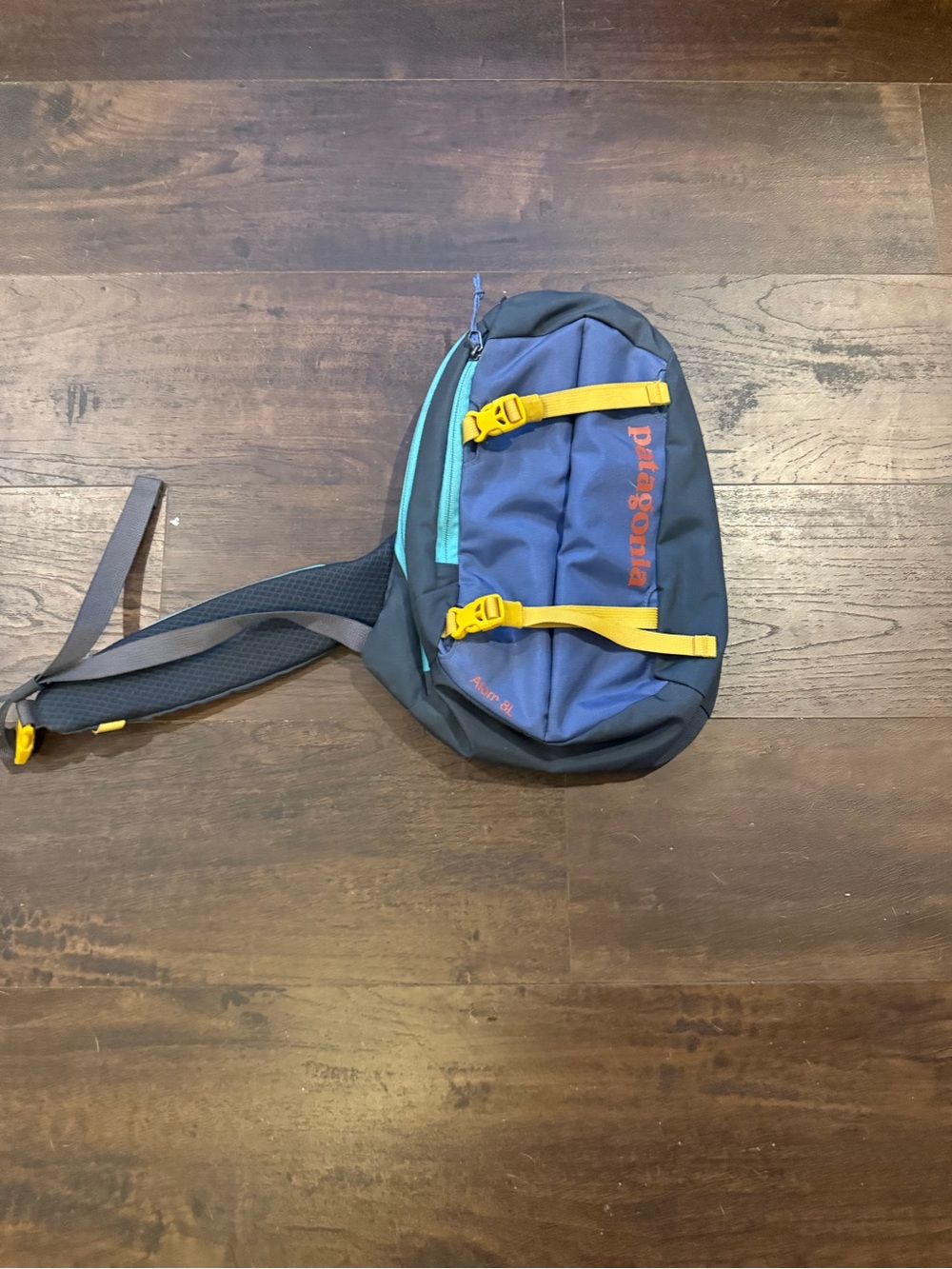 Patagonia Navy and Teal Sling Bag with Yellow Straps
